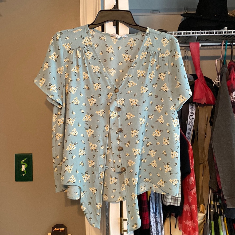 Blue blouse with white flowers